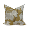 Floral-patterned pillow with white flowers on a yellow background