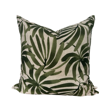 Decorative pillow with green leaf pattern on a white background