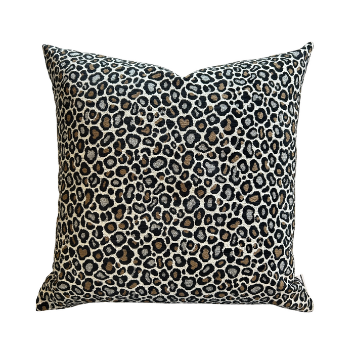 Leopard print pillow on a white background