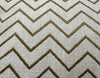 Textured off-white scatter cushion featuring a close-up of embroidered olive green and khaki zig-zag chevron patterns.