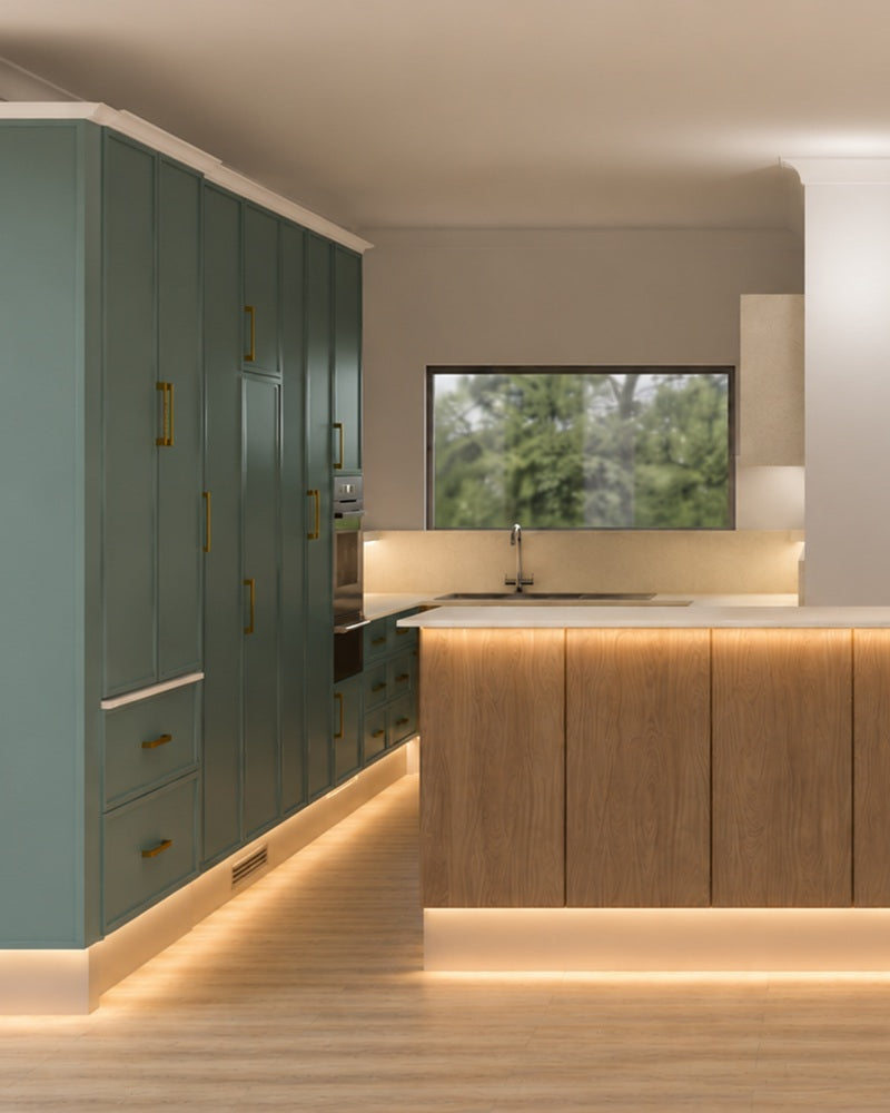 Symmetrical square layout showcasing custom sage green kitchen cabinets, premium gold handles, and a central wood island with warm ambient base lighting.