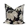 Decorative pillow with floral pattern on a black background