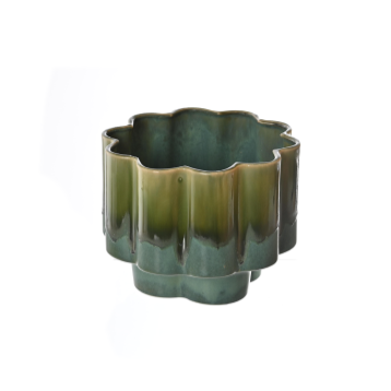 Green ceramic candle holder on a white background