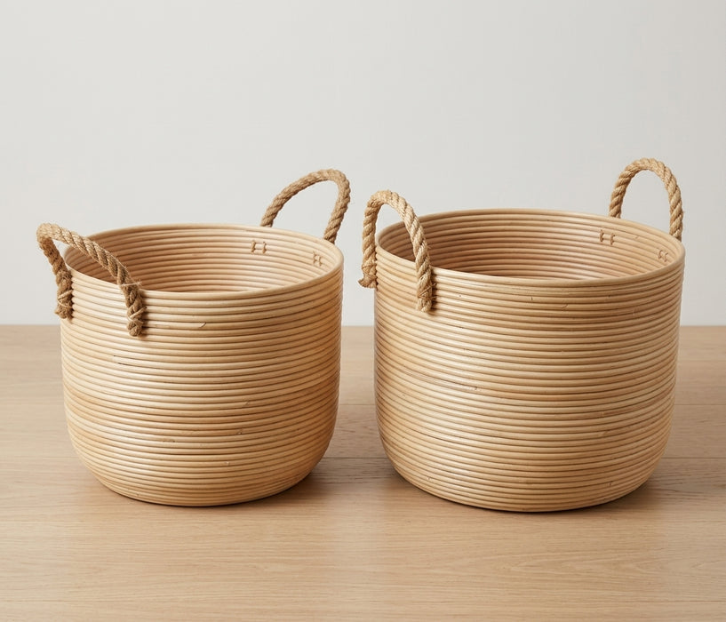 Set of two handwoven natural rattan Ralph storage baskets featuring thick coiled horizontal textures and durable braided rope handles, perfect for organic home storage or planter use.