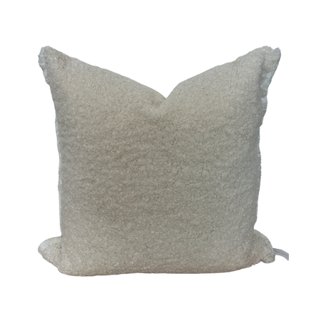 Beige textured pillow on a white background