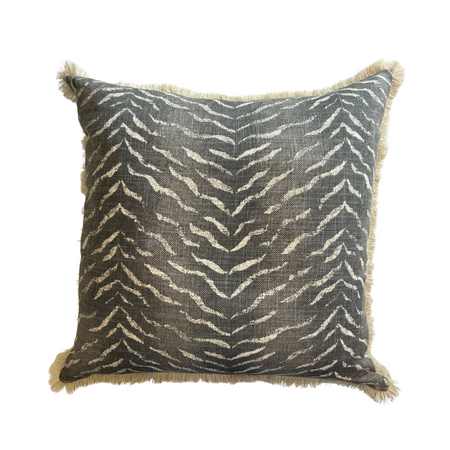 Decorative pillow with a zebra pattern on a white background